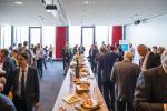 Guests enjoy continued discussions at a networking apero